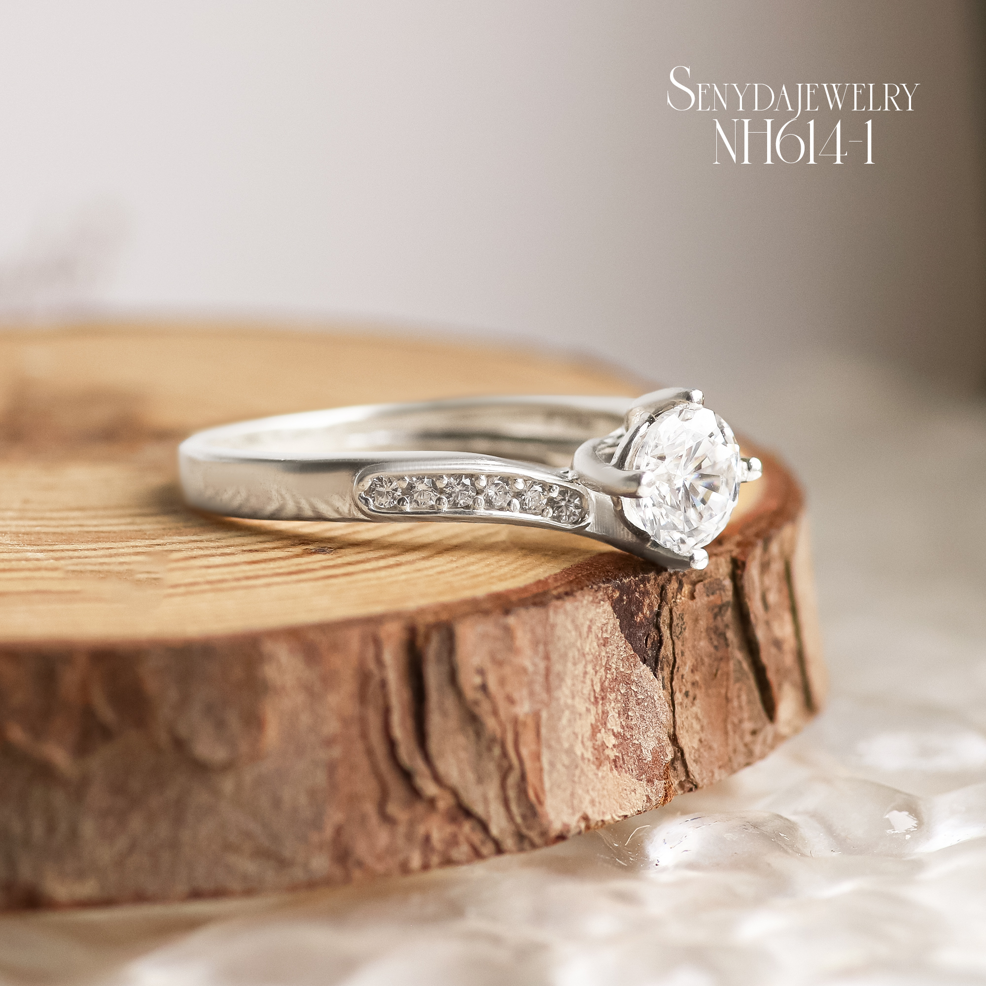 NH614 Nhẫn bạc Ý Senyda 1 hột 4 chấu đai chéo đá